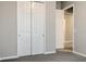 Bedroom with grey carpet, white trim, and closet with sliding doors at 16271 Silver Grove Blvd, Winter Garden, FL 34787