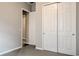 Bedroom with grey carpet, white trim, and closet with sliding doors at 16271 Silver Grove Blvd, Winter Garden, FL 34787