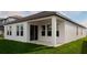 The back of the house has many windows and a covered porch at 16271 Silver Grove Blvd, Winter Garden, FL 34787
