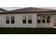 The back of the house with a grassy yard at 16271 Silver Grove Blvd, Winter Garden, FL 34787