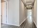 Long hallway with wood floors and an accent ceiling at 16271 Silver Grove Blvd, Winter Garden, FL 34787