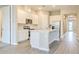 Bright, open kitchen boasts a large island and stainless steel appliances, creating a stylish and functional space at 16271 Silver Grove Blvd, Winter Garden, FL 34787
