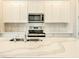 Close-up of kitchen island with stainless steel sink and faucet at 16271 Silver Grove Blvd, Winter Garden, FL 34787