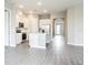An open kitchen has white cabinets, stainless steel appliances, and a center island at 16271 Silver Grove Blvd, Winter Garden, FL 34787