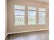 Three large windows with backyard views enhance the natural light and ambiance of the home at 16271 Silver Grove Blvd, Winter Garden, FL 34787