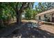 Spacious backyard features a large tree providing ample shade and privacy at 1635 Magnolia Ave, South Daytona, FL 32119