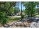 Charming single-story home with a long driveway and lush greenery at 1635 Magnolia Ave, South Daytona, FL 32119