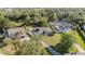 Expansive aerial view of a single Gathering home showcasing a long driveway and mature trees at 1651 Big Oak Ln, Kissimmee, FL 34746