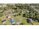 Aerial view of a neighborhood, showcasing mature trees and cul-de-sac street at 1651 Big Oak Ln, Kissimmee, FL 34746