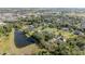 Expansive aerial view of a luxurious neighborhood with lush greenery, serene ponds, and beautiful homes at 1651 Big Oak Ln, Kissimmee, FL 34746
