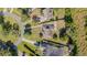 An aerial view of a residential property, highlighting the roof, yard, and driveway at 1651 Big Oak Ln, Kissimmee, FL 34746