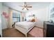 A cozy bedroom featuring a twin bed, plush decor, and a sunny window at 1651 Big Oak Ln, Kissimmee, FL 34746