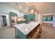 Bright, spacious kitchen with a large island, stainless steel appliances, and custom cabinetry at 1651 Big Oak Ln, Kissimmee, FL 34746