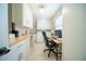 Functional laundry and office space with built-in cabinets, sink, and workspace at 1651 Big Oak Ln, Kissimmee, FL 34746