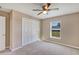 Cozy bedroom with a closet, window, carpet, and base trim with neutral walls at 16771 Sw 21St Terrace Rd, Ocala, FL 34473