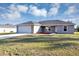 Charming single-story home featuring a two-car garage and landscaped yard at 16771 Sw 21St Terrace Rd, Ocala, FL 34473