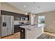 Gourmet kitchen with stainless steel appliances, custom cabinetry, and a spacious island for entertaining at 16771 Sw 21St Terrace Rd, Ocala, FL 34473