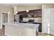 Spacious kitchen with stainless steel appliances, granite counters and center island at 16771 Sw 21St Terrace Rd, Ocala, FL 34473