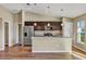 Modern kitchen with stainless steel appliances and a center island at 16771 Sw 21St Terrace Rd, Ocala, FL 34473