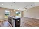 View of the kitchen island, stainless steel dishwasher, and open layout to the living room at 16771 Sw 21St Terrace Rd, Ocala, FL 34473