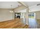 Spacious living room featuring hardwood floors and an open view to the kitchen at 16771 Sw 21St Terrace Rd, Ocala, FL 34473
