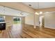 Open living room with hardwood floors and a sliding glass door to the backyard at 16771 Sw 21St Terrace Rd, Ocala, FL 34473