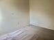 Bedroom with neutral walls, carpeted floor, electrical outlet and some visible wear at 1805 San Luis Ln, The Villages, FL 32159
