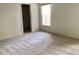 Bedroom featuring neutral walls, carpet, a walk-in closet and natural light from a window at 1805 San Luis Ln, The Villages, FL 32159