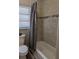Bathroom featuring tiled shower and tub combination at 2013 Sarazen Ct, Orlando, FL 32808