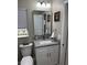 Renovated bathroom showcasing a granite vanity, modern fixtures, and stylish decor at 2013 Sarazen Ct, Orlando, FL 32808
