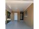Spacious carport area with access to storage and the home's entrance, providing sheltered parking at 2013 Sarazen Ct, Orlando, FL 32808