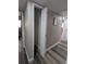 Hallway closet with bi-fold doors and wire shelving for convenient storage at 2013 Sarazen Ct, Orlando, FL 32808