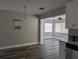 Living room with neutral walls, updated flooring, and natural light at 2013 Sarazen Ct, Orlando, FL 32808