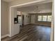 Open-concept living room with new floors, updated fixtures, and an abundance of natural light at 2013 Sarazen Ct, Orlando, FL 32808