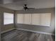 Living room with neutral walls, updated flooring, and natural light at 2013 Sarazen Ct, Orlando, FL 32808