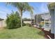 Well-manicured backyard and pool with screened enclosure and a playful inflatable yellow duck at 212 Hazeltine Dr, Debary, FL 32713