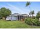 An exterior shot of the house highlighting the backyard pool with screened enclosure at 212 Hazeltine Dr, Debary, FL 32713