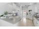 Bright kitchen featuring white cabinets, gray countertops, and modern appliances at 212 Hazeltine Dr, Debary, FL 32713