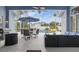 This screened lanai features comfortable seating, dining area, and a beautiful view of the pool at 212 Hazeltine Dr, Debary, FL 32713