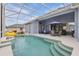 This backyard pool has a screened enclosure with a dining area and an inflatable yellow duck at 212 Hazeltine Dr, Debary, FL 32713
