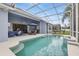 Inviting screened-in pool area with outdoor seating, perfect for entertaining and relaxation at 212 Hazeltine Dr, Debary, FL 32713