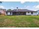 Spacious backyard with well-maintained lawn and the back of the house is visible at 216 Shady Oaks Cir, Lake Mary, FL 32746