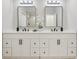 Bathroom featuring a double sink vanity with dark hardware and a white countertop at 216 Shady Oaks Cir, Lake Mary, FL 32746