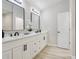 Updated bathroom features double sinks, vanity and modern fixtures at 216 Shady Oaks Cir, Lake Mary, FL 32746
