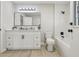 Updated bathroom features a white vanity, tiled shower, and modern fixtures at 216 Shady Oaks Cir, Lake Mary, FL 32746