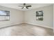 The bedroom is bright and airy with hardwood floors and many windows at 216 Shady Oaks Cir, Lake Mary, FL 32746