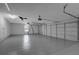 Spacious three-car garage featuring epoxy floors, ample storage, and convenient access to the home at 216 Shady Oaks Cir, Lake Mary, FL 32746