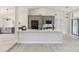 Modern kitchen features gray cabinets, a large island, and stainless steel appliances at 216 Shady Oaks Cir, Lake Mary, FL 32746