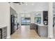 Stylish kitchen with gray cabinets, white countertops, and views of the backyard at 216 Shady Oaks Cir, Lake Mary, FL 32746