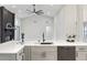 Contemporary kitchen features a center island, gray cabinets, and stainless steel dishwasher at 216 Shady Oaks Cir, Lake Mary, FL 32746